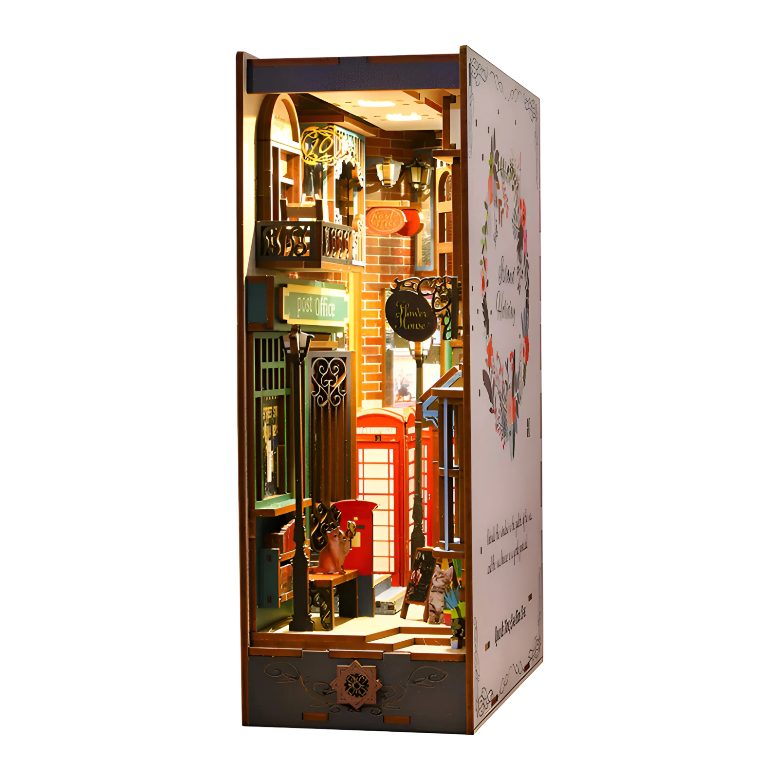 Crown Street miniature: a warm lamplit London street scene with a post office, red telephone box and small cats.